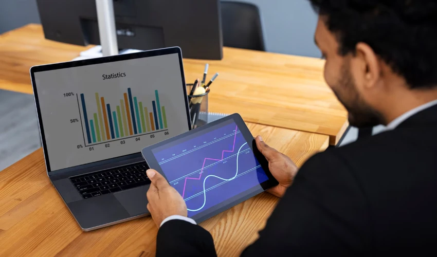 Data analyst using dashboards and analytics tools to support business decisions
