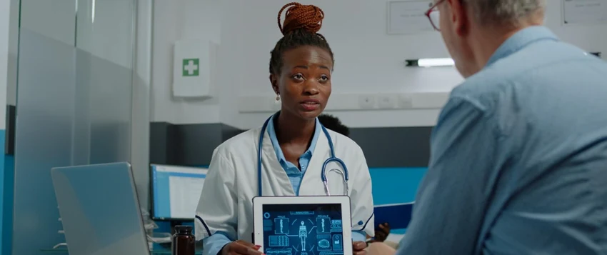Healthcare professional explaining electronic health records to a patient