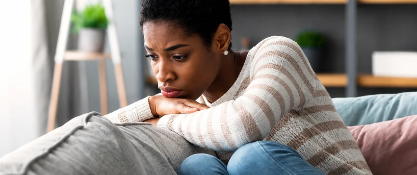 Woman reflecting on the emotional challenges of leaving an abusive relationship